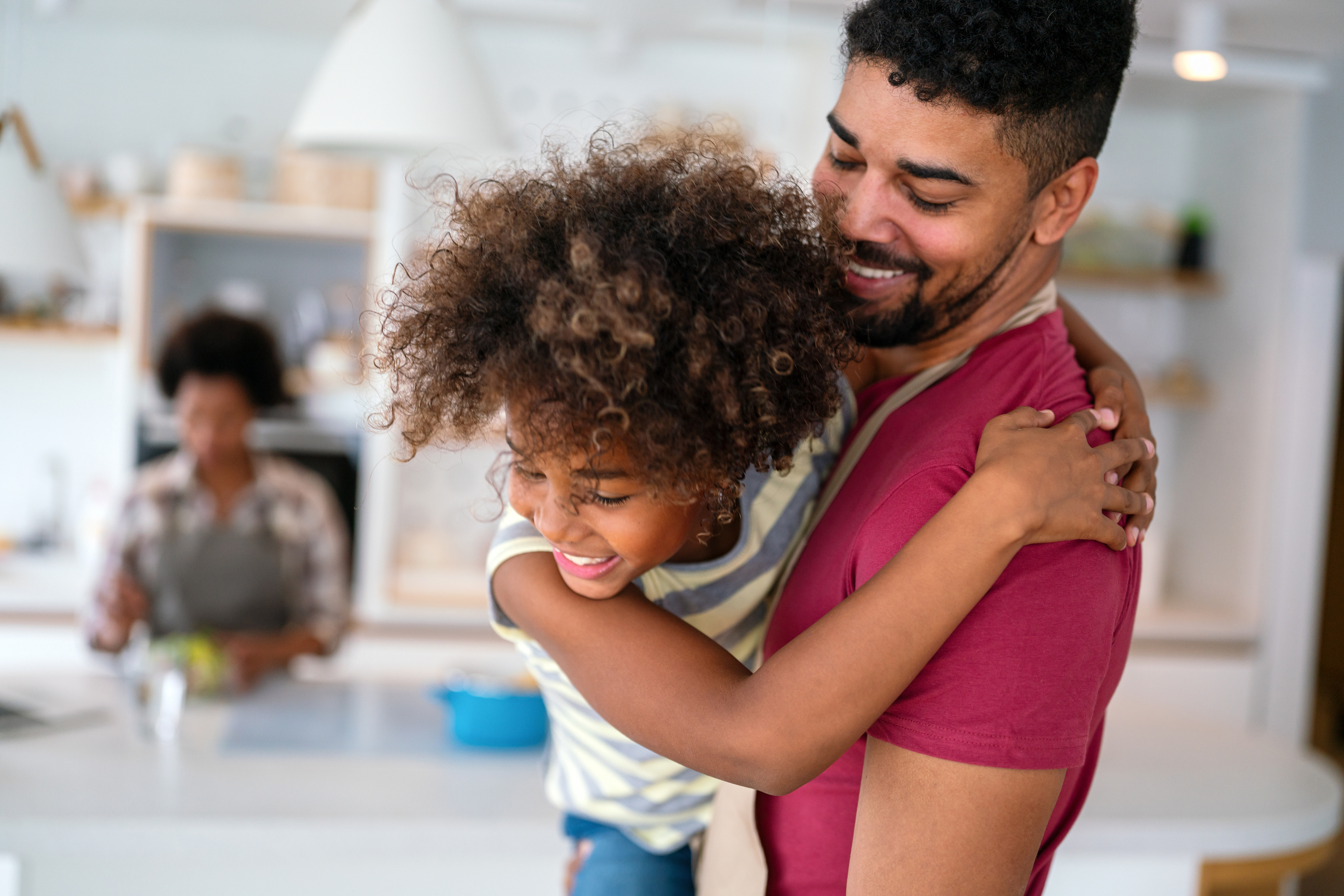 Happy Father and Child Custody Appeal in Huntersville North Carolina LKN Law Smiling father holding his child outdoors in Huntersville North Carolina representing hope and determination during a custody appeal