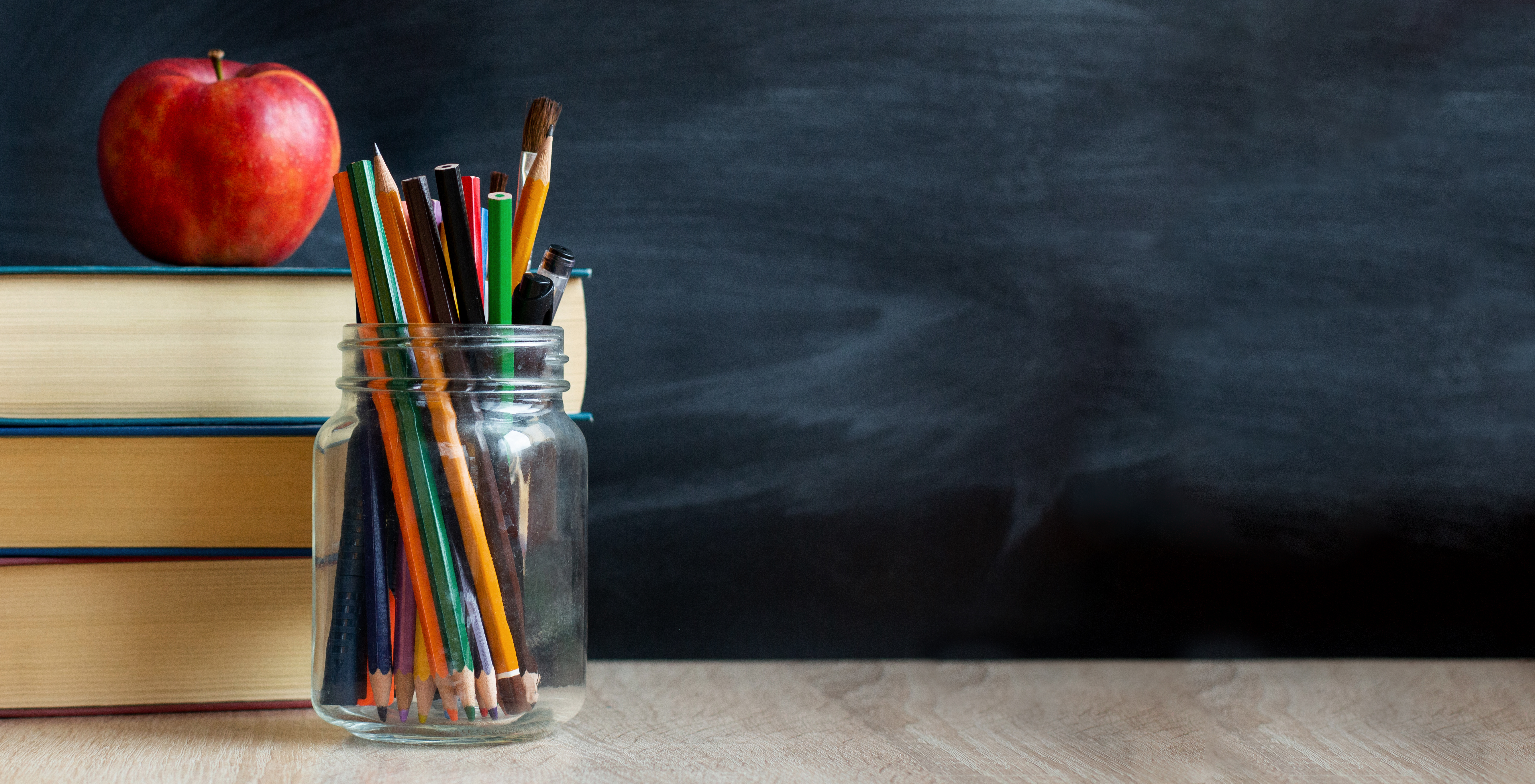 School Chalkboard Child Custody and Family Law in Huntersville North Carolina LKN Law School classroom chalkboard with books and apple symbolizing education stability and child custody cases in Huntersville North Carolina