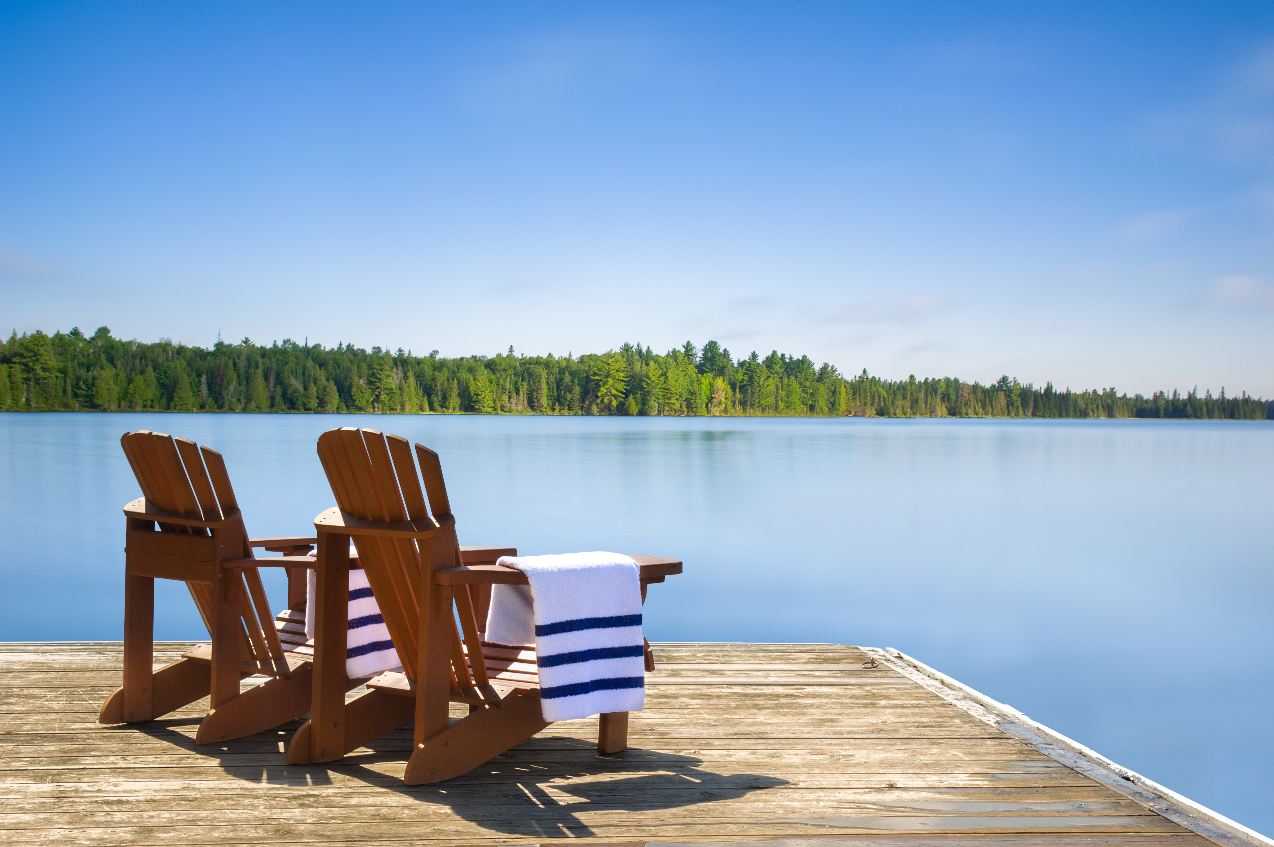 Sherrills Ford Dock on Lake Norman North Carolina LKN Law Wooden dock extending into the water at Sherrills Ford on Lake Norman with trees and shoreline in the distance