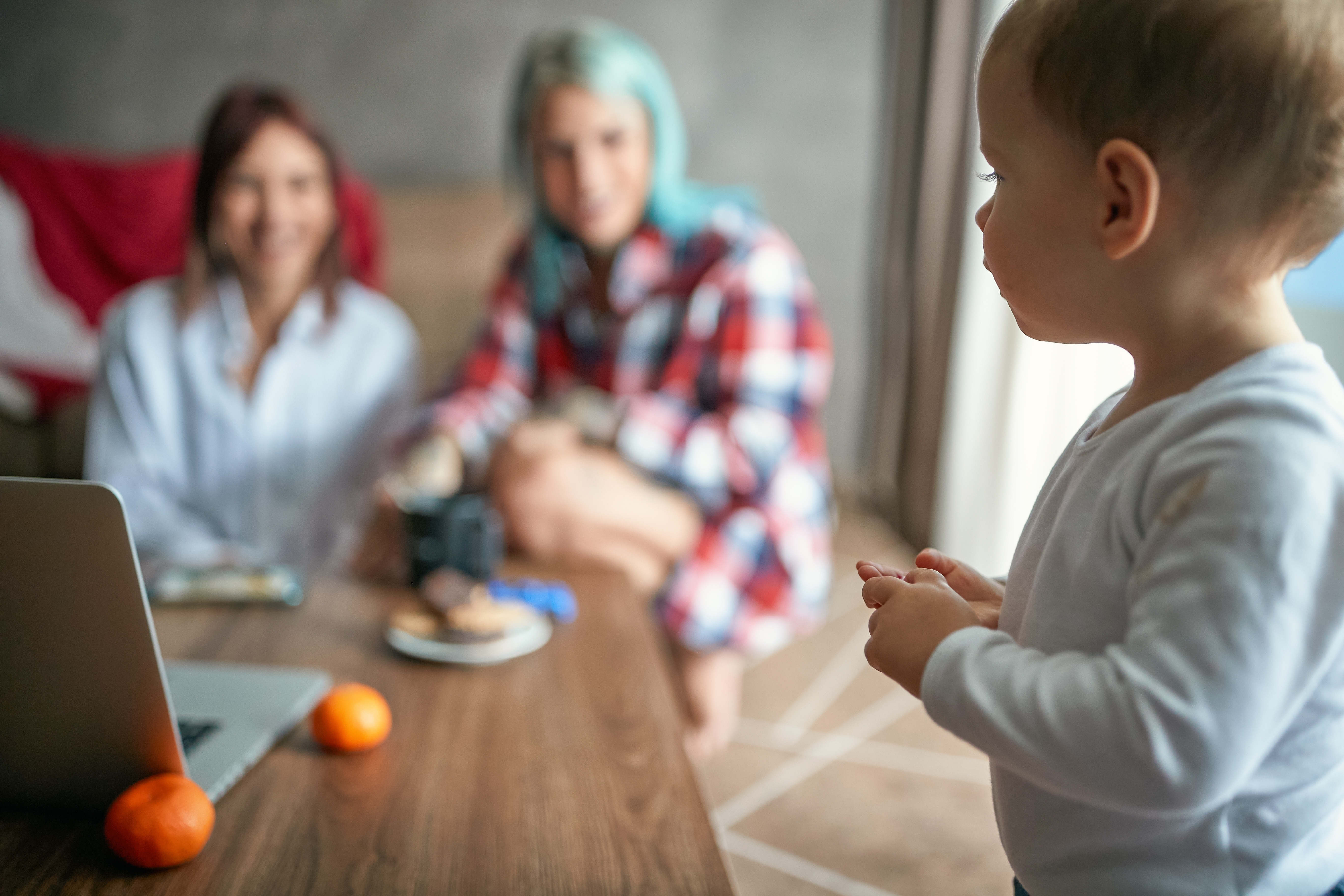 Child with Parent and Grandparent Custody Case in Lake Norman North Carolina LKN Law Child sitting with parent and grandparent during a custody discussion in the Lake Norman area of North Carolina symbolizing family support and multi generational care