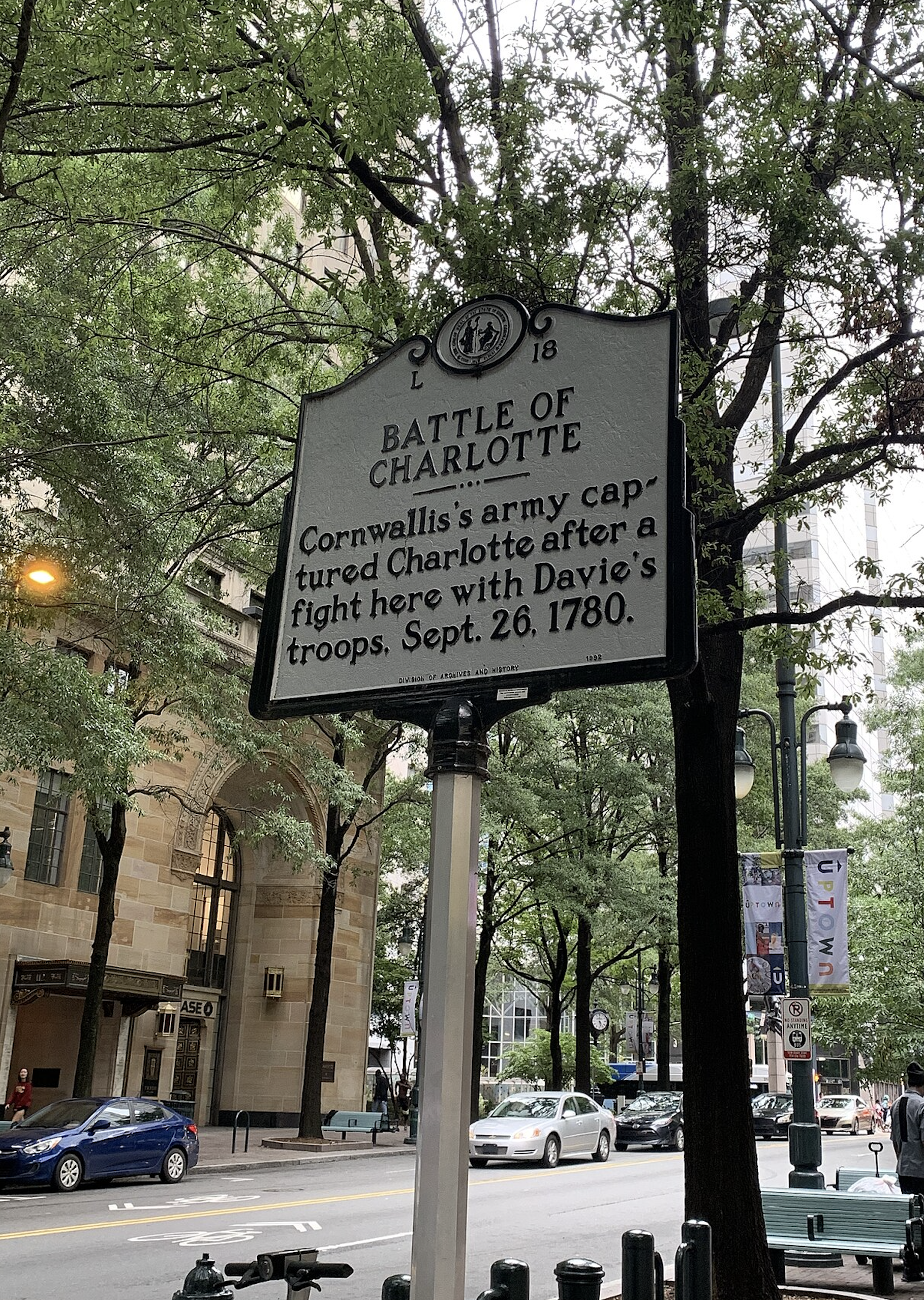 Battle of Charlotte historical marker in Uptown Charlotte, North Carolina, commemorating the 1780 Revolutionary War clash between Patriot militia and British forces under Cornwallis.