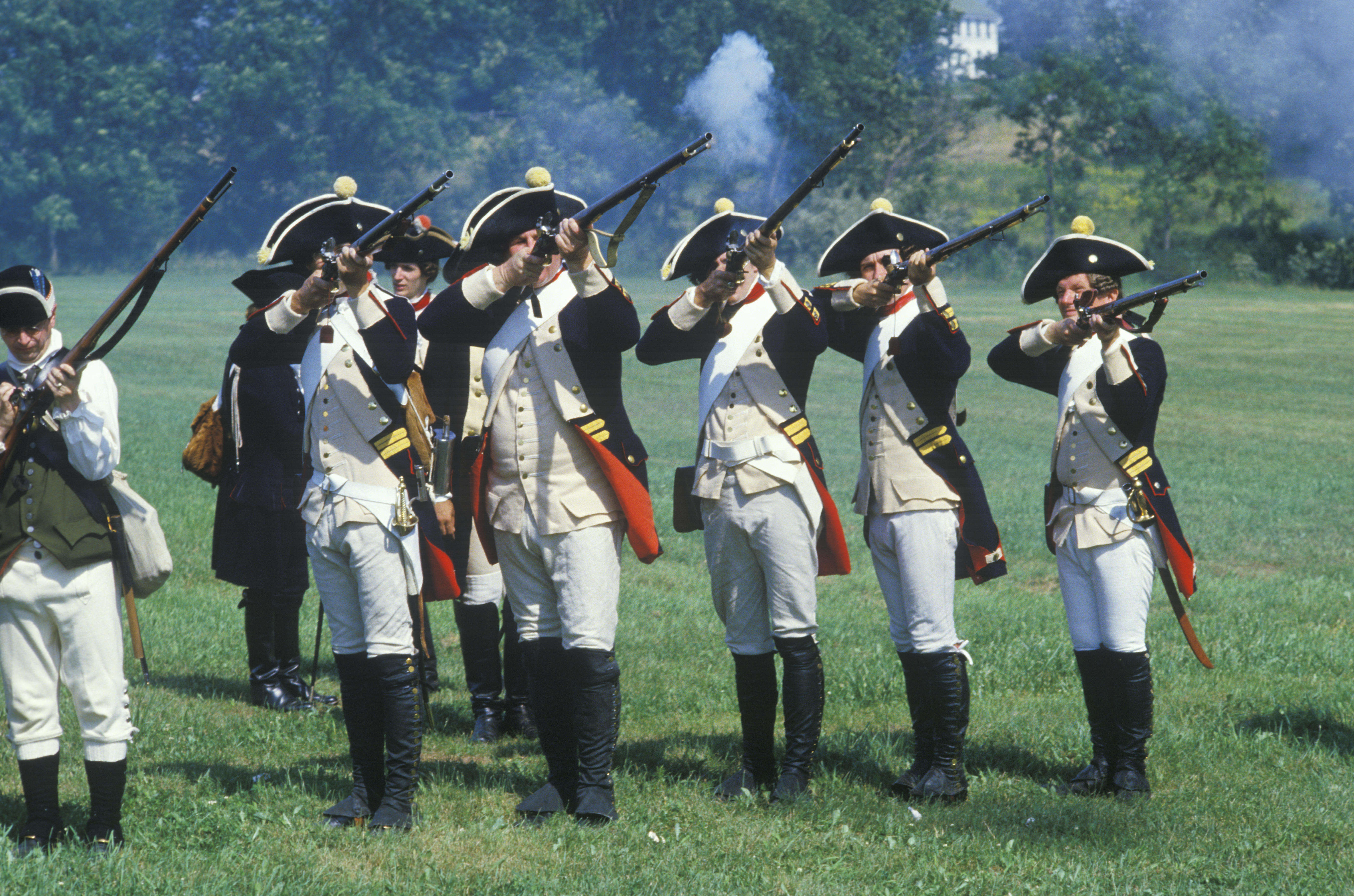 Historical reenactors portraying Patriot militia and British dragoons during the Battle of Clapps Mill also known as the Ambush at Beaver Creek near Burlington in Alamance County North Carolina