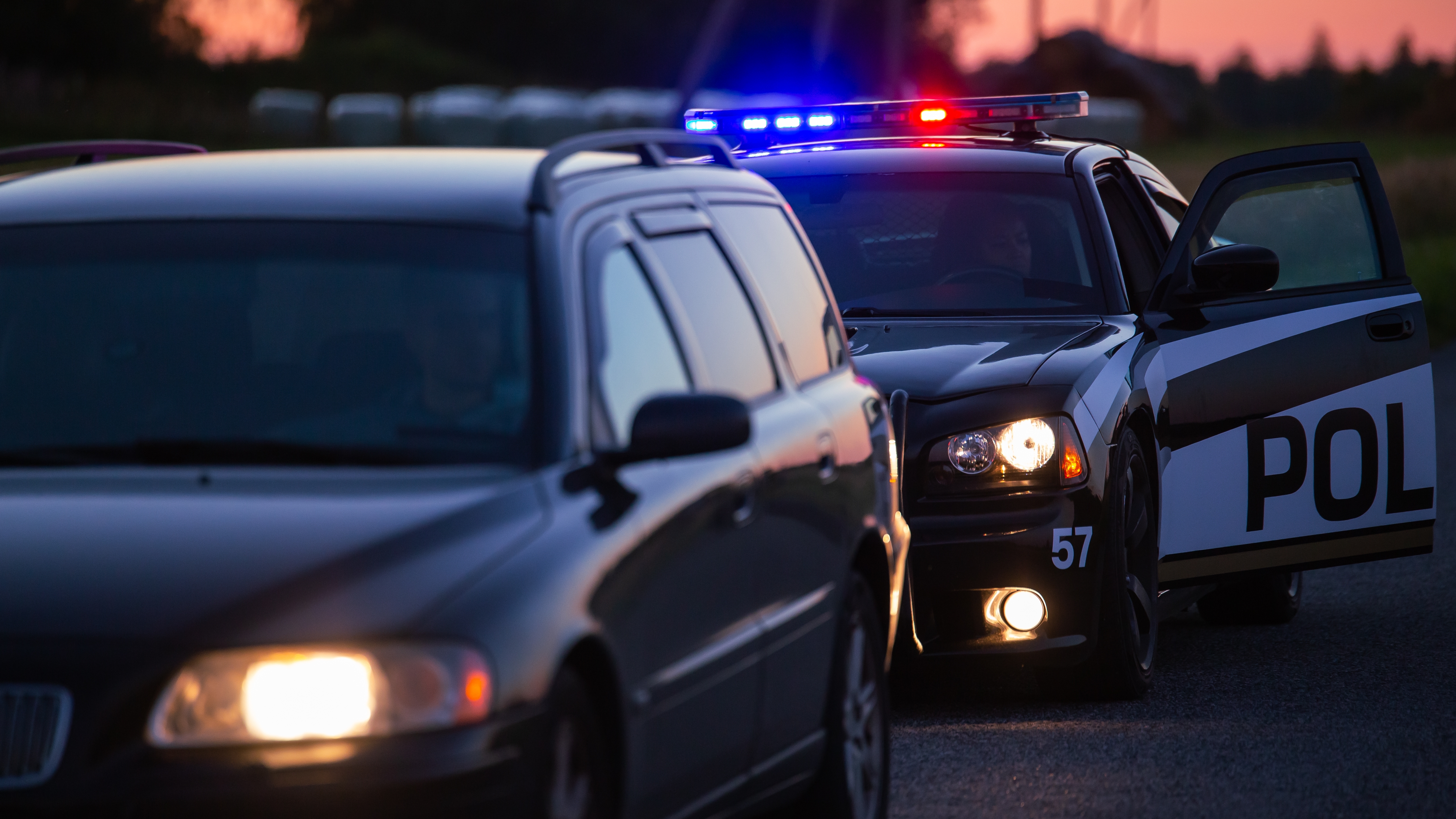Police officer conducting a traffic stop in Huntersville North Carolina for a driver with a suspended license