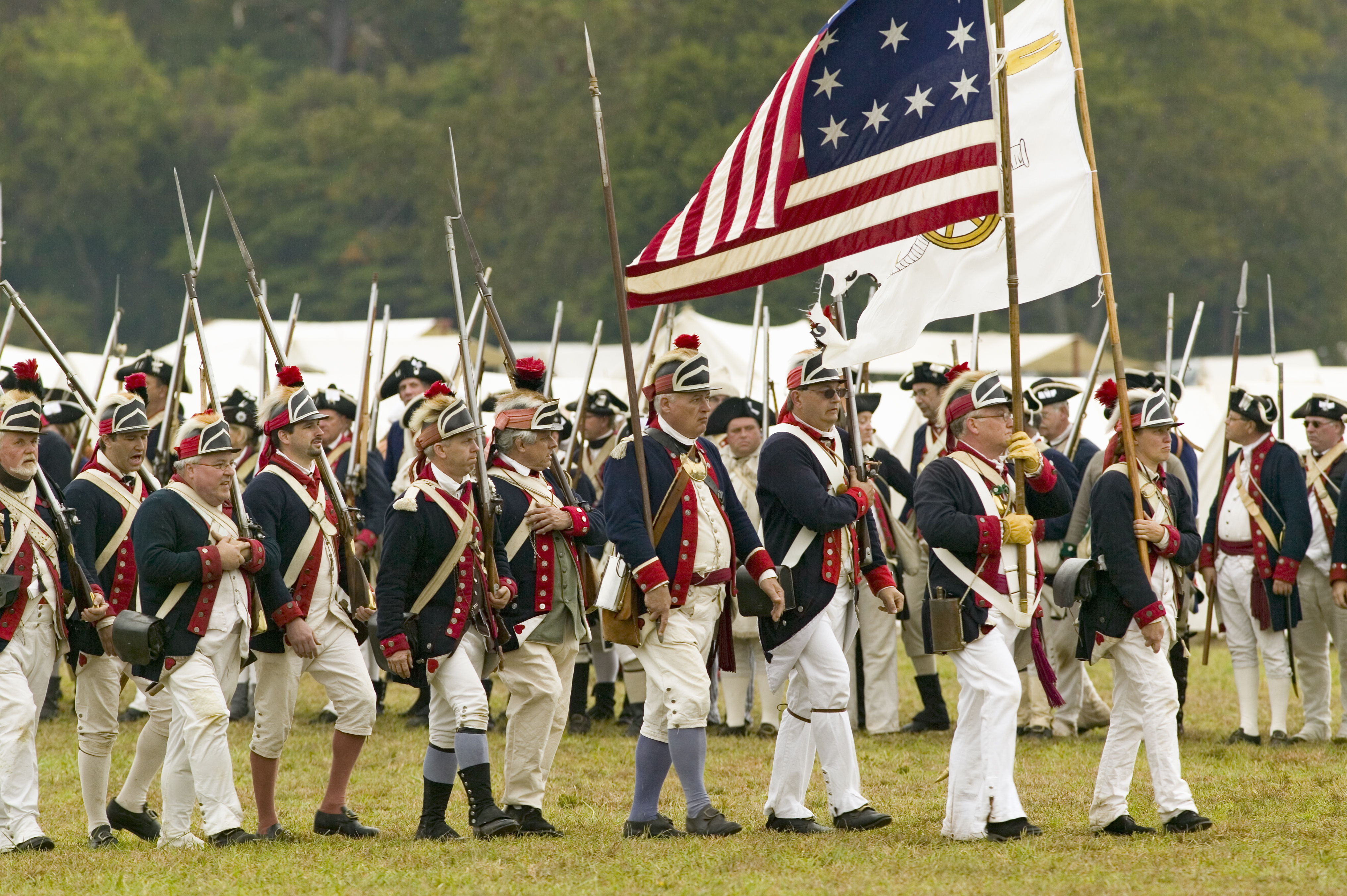 Patriot militia soldiers engage Loyalist forces on the fog covered hillside during the Battle of Ramsours Mill near Lincolnton North Carolina in June 1780
